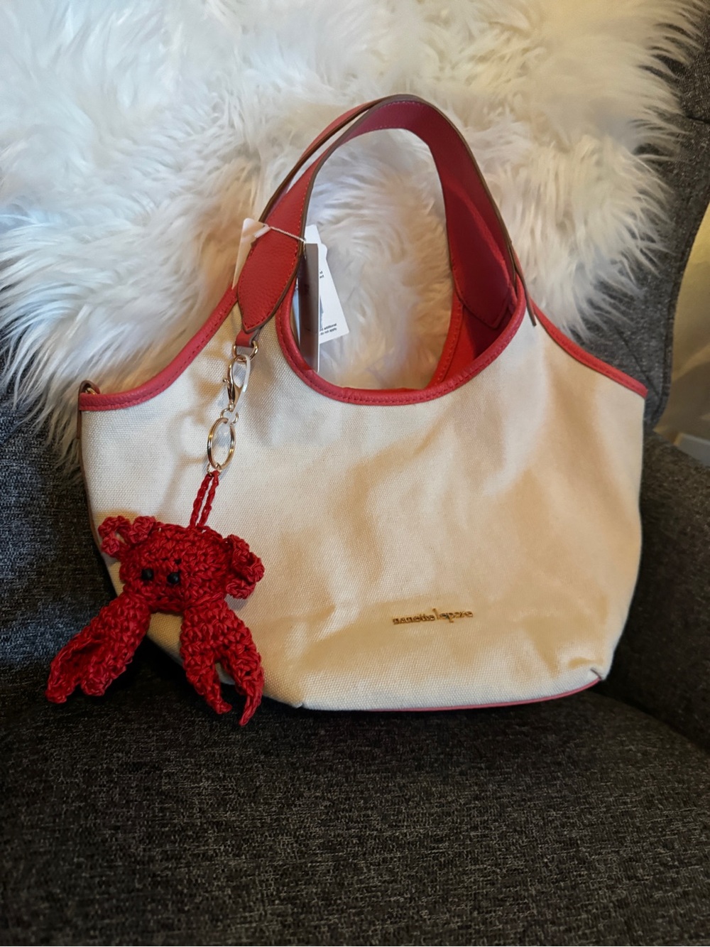 Nanette Lepore Cream Canvas Tote with Red Trim and Crochet Charm